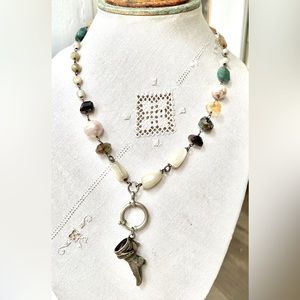 Genuine semi precious stone necklace with an antique silver boot pendant.